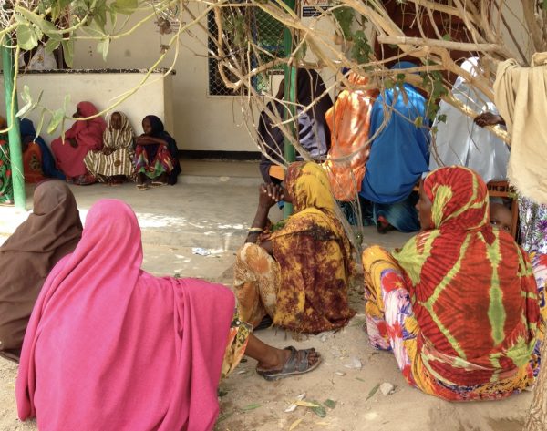 Women gathered in a court yard